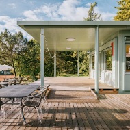 Light-green Sportfeld pavilion with terrace and seating