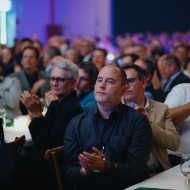 Audience applauding attentively and respectfully at Blumer Lehmann’s 150th anniversary – close-up with table 17 in the foreground.