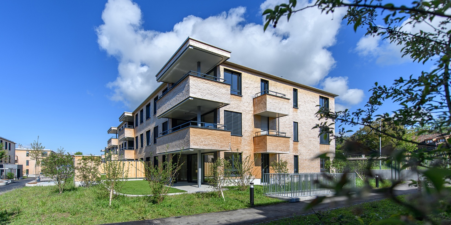 An apartment building that combines the wooden and glazed elements.