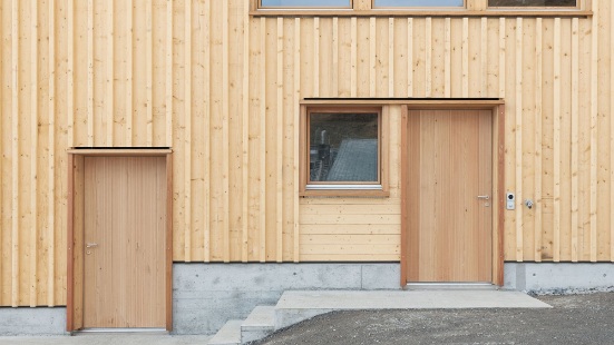 Detailed view of the timber facade with two doors